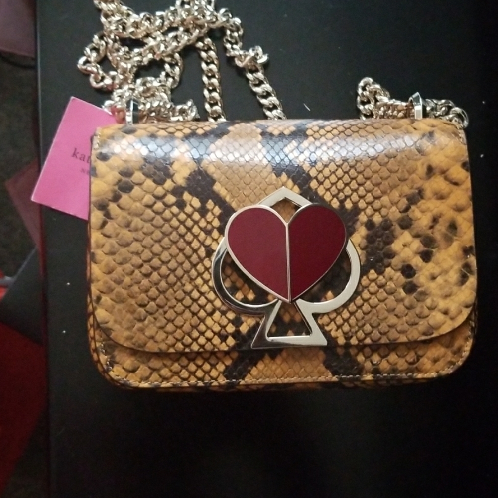 Nicola yellow snake skin purse.